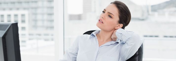 Chiropractic Bentonville AR Woman in Office With Neck Pain